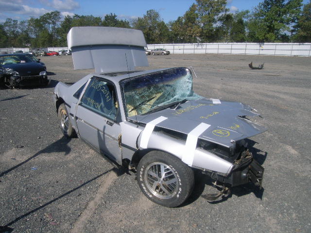 A 1985 Pontiac Fiero econo-commuter in a Northern California wrecking yard.